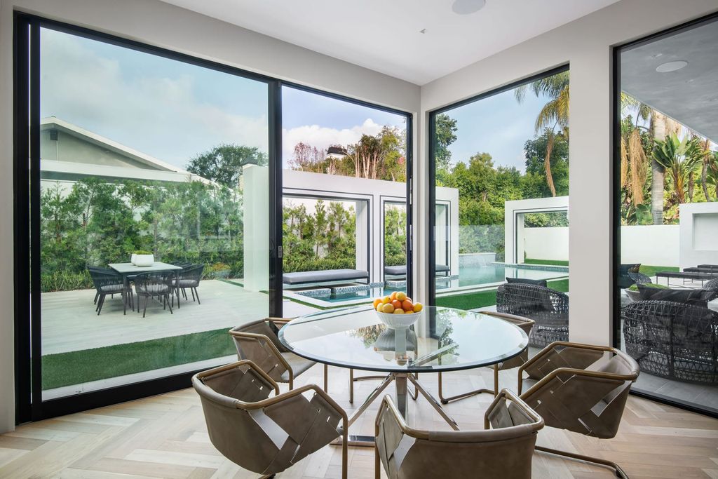 The Home in Beverly Hills is a contemporary new-build, designed by Gabbay Architects is sited behind mature olive trees now available for sale. This home located at 1729 Angelo Dr, Beverly Hills, California