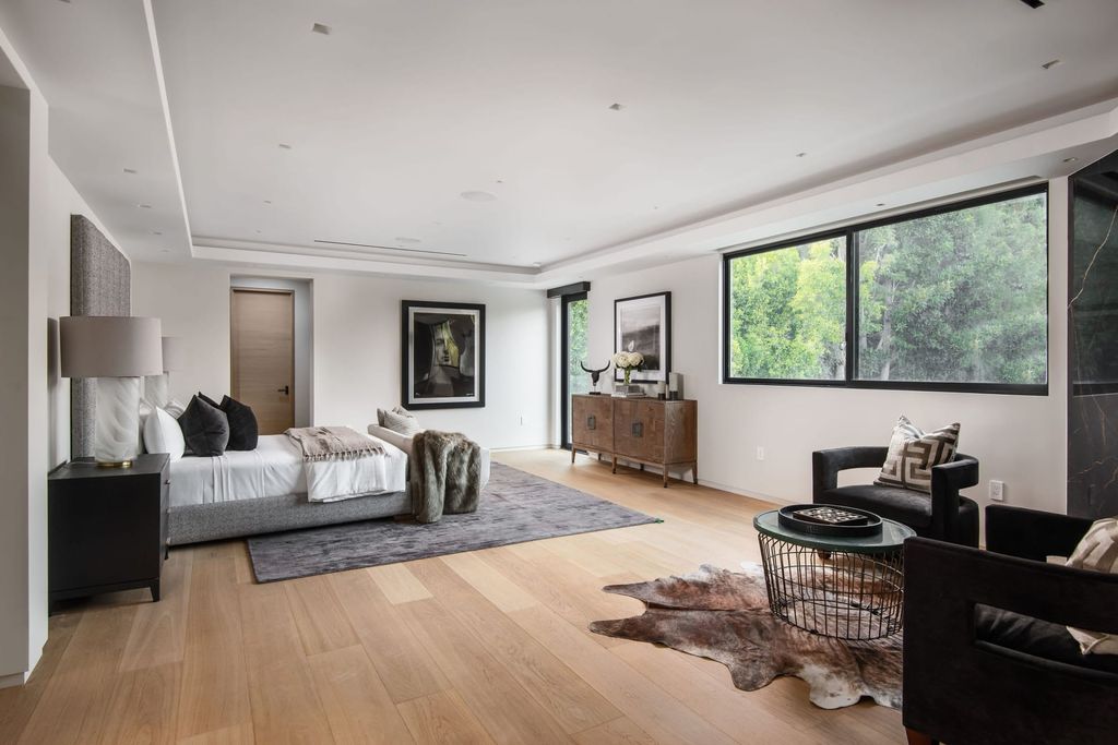 The Home in Beverly Hills is a contemporary new-build, designed by Gabbay Architects is sited behind mature olive trees now available for sale. This home located at 1729 Angelo Dr, Beverly Hills, California