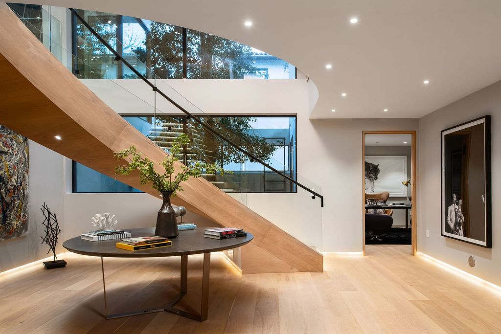 The Home in Beverly Hills is a contemporary new-build, designed by Gabbay Architects is sited behind mature olive trees now available for sale. This home located at 1729 Angelo Dr, Beverly Hills, California