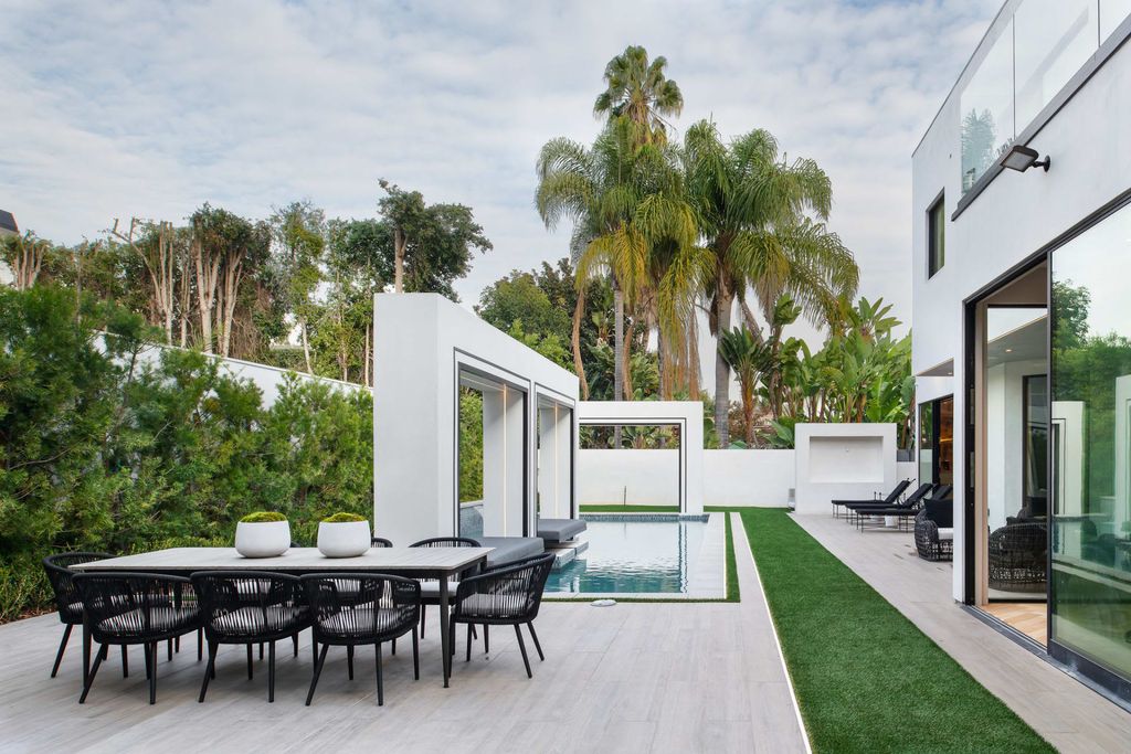 The Home in Beverly Hills is a contemporary new-build, designed by Gabbay Architects is sited behind mature olive trees now available for sale. This home located at 1729 Angelo Dr, Beverly Hills, California