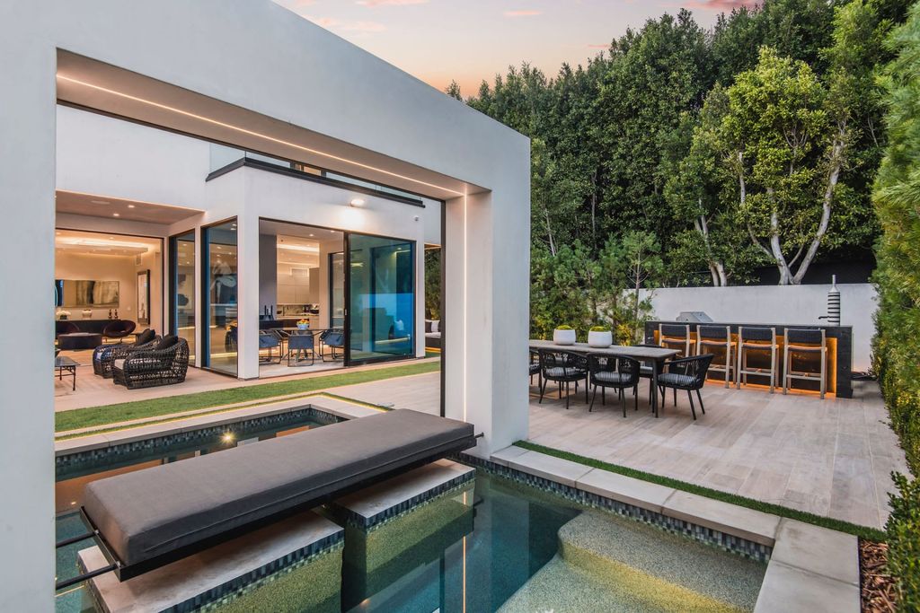 The Home in Beverly Hills is a contemporary new-build, designed by Gabbay Architects is sited behind mature olive trees now available for sale. This home located at 1729 Angelo Dr, Beverly Hills, California