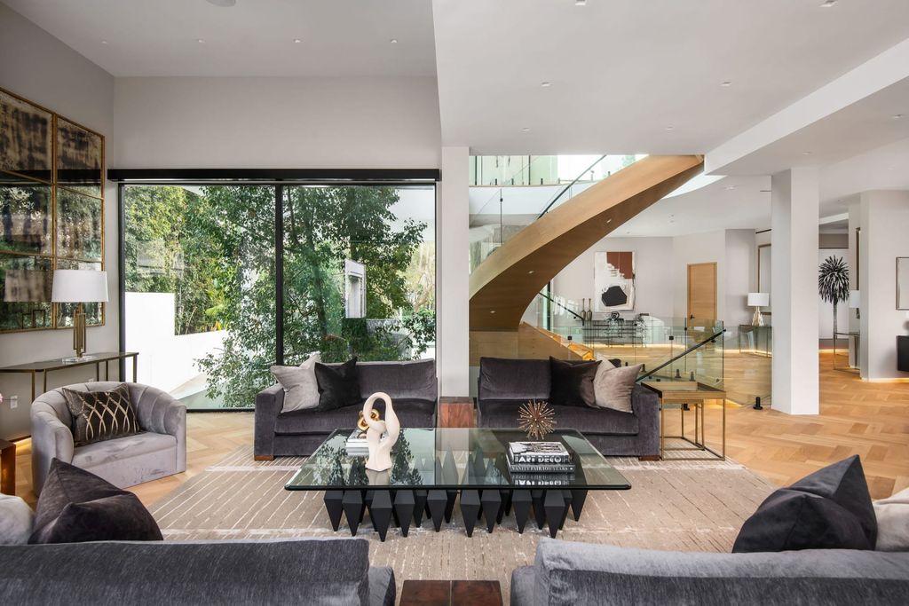 The Home in Beverly Hills is a contemporary new-build, designed by Gabbay Architects is sited behind mature olive trees now available for sale. This home located at 1729 Angelo Dr, Beverly Hills, California