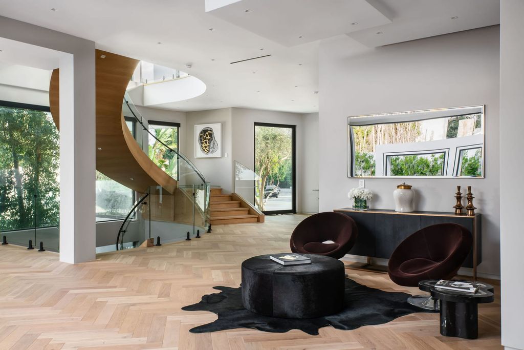 The Home in Beverly Hills is a contemporary new-build, designed by Gabbay Architects is sited behind mature olive trees now available for sale. This home located at 1729 Angelo Dr, Beverly Hills, California