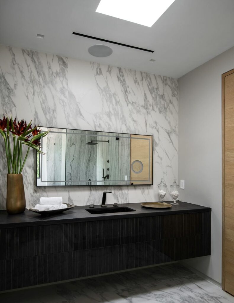 The Home in Beverly Hills is a contemporary new-build, designed by Gabbay Architects is sited behind mature olive trees now available for sale. This home located at 1729 Angelo Dr, Beverly Hills, California