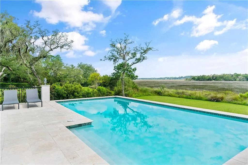 The Home in Georgia is a luxurious home which is well constructed under South Florida architecture influence now available for sale. This home located at 400 Hawkins Island Dr, Saint Simons Island, Georgia; offering 06 bedrooms and 06 bathrooms with 5,985 square feet of living spaces. 