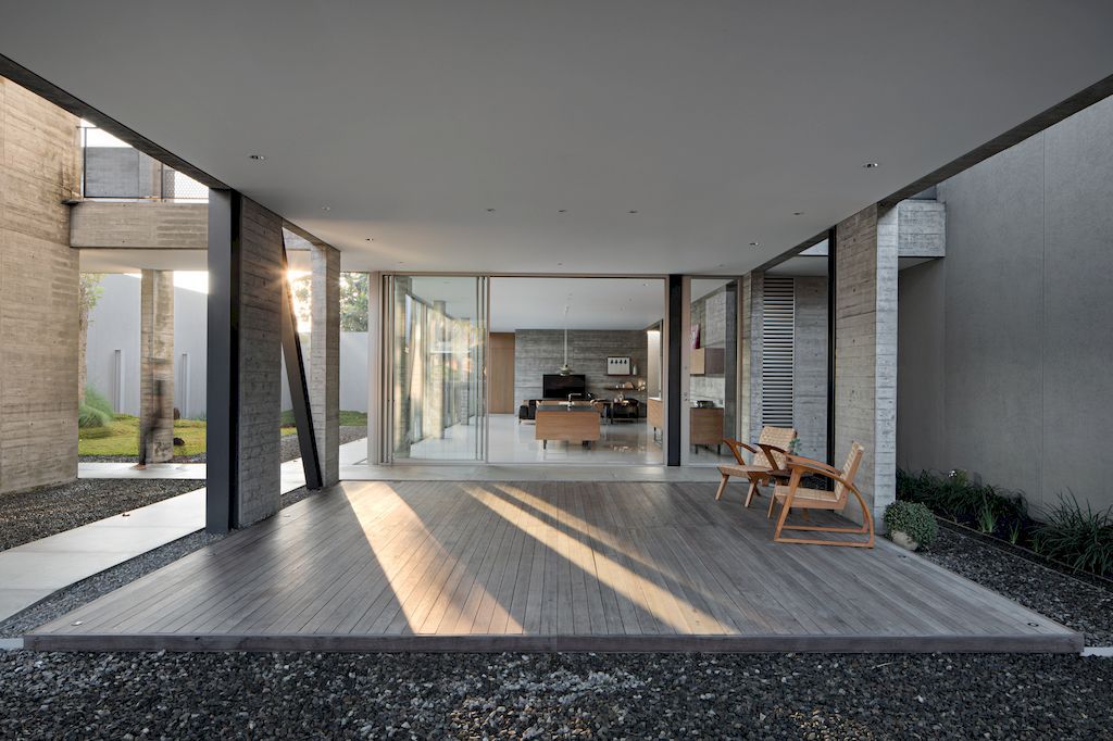 Hover House with rustic brutal of concrete Design by Pranala Associates 17