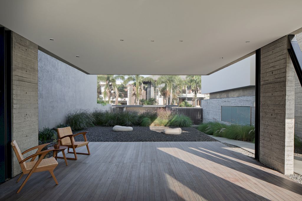 Hover House with rustic & brutal of concrete Design by Pranala Associates