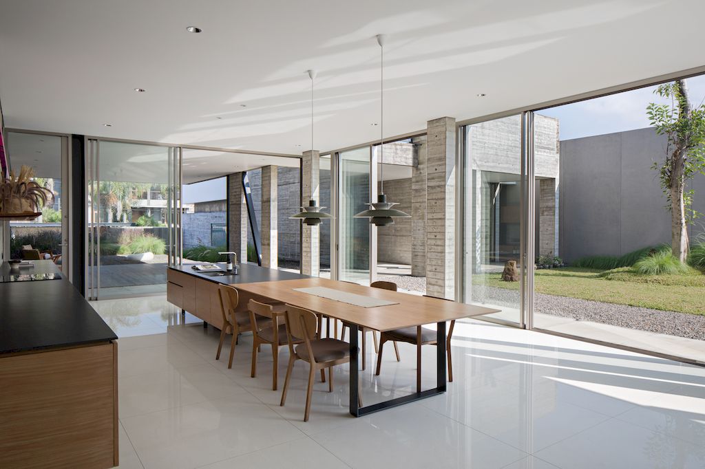 Hover House with rustic brutal of concrete Design by Pranala Associates 21
