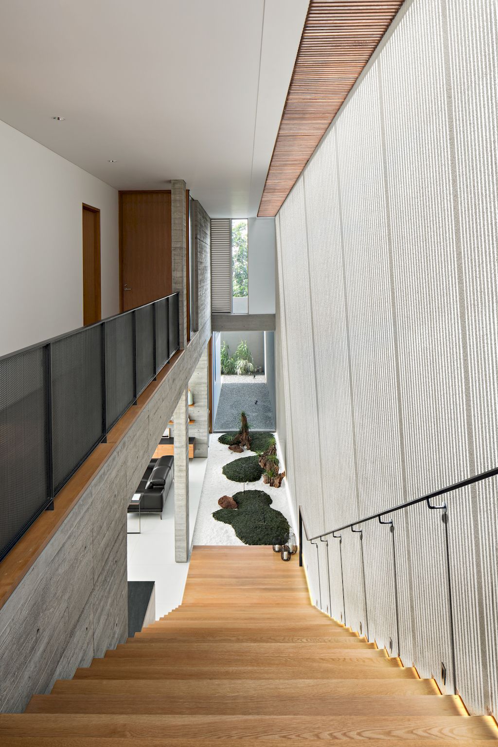 Hover House with rustic brutal of concrete Design by Pranala Associates 25