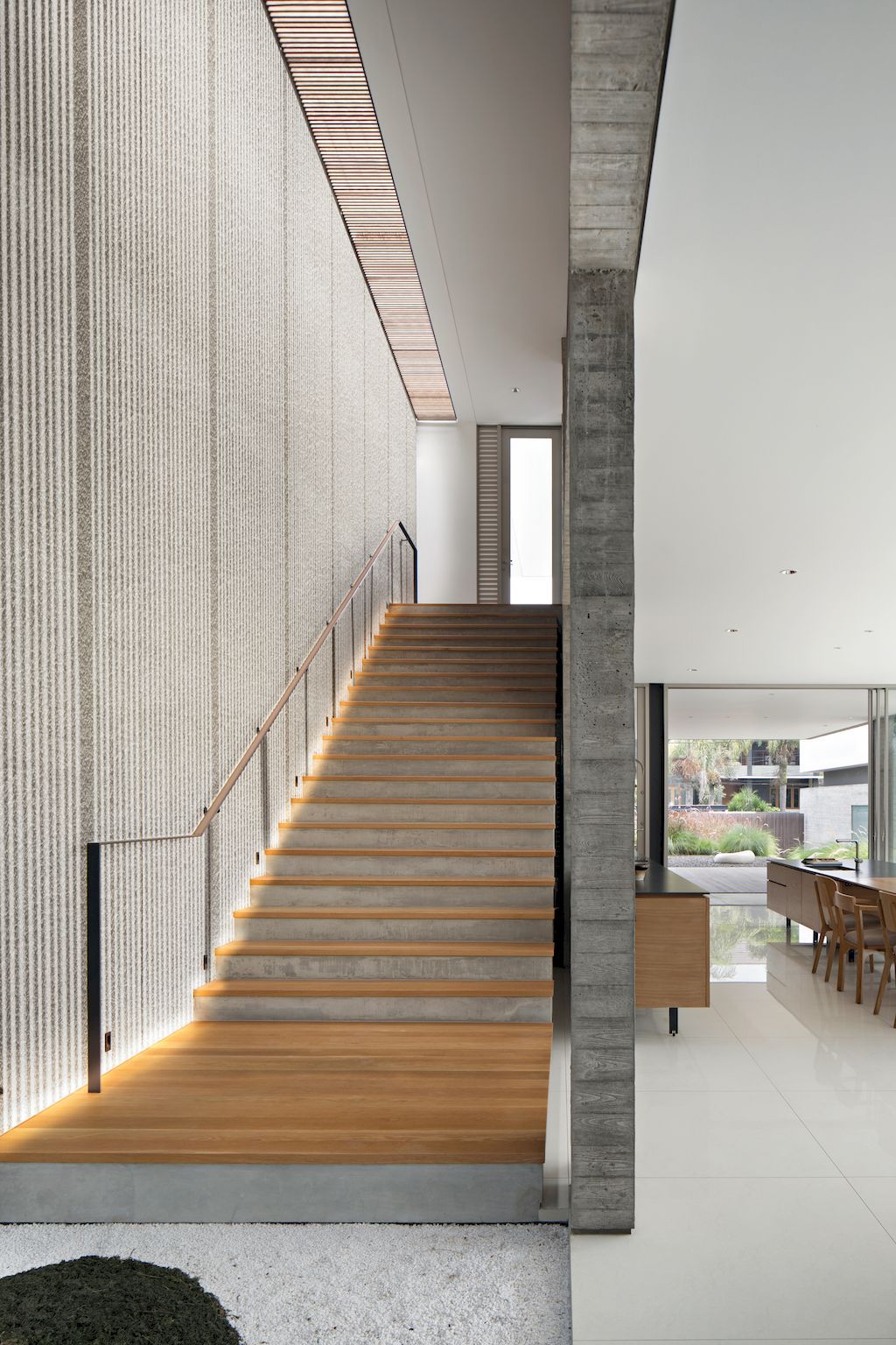 Hover House with rustic & brutal of concrete Design by Pranala Associates