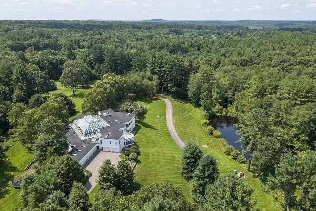 The Home in Massachusetts is a luxurious home offering large scale entertaining and comfortable living now available for sale. This home located at 201 Concord St, Carlisle, Massachusetts; offering 05 bedrooms and 08 bathrooms with 15,193 square feet of living spaces.