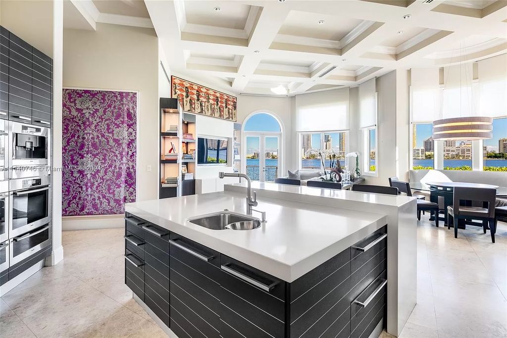 The Miami Beach Home is a unique tri-level estates sits along 251 feet of wide bay views and has 2 deeded docks now available for sale. This house located at 042 Island Estates Dr, North Miami Beach, Florida