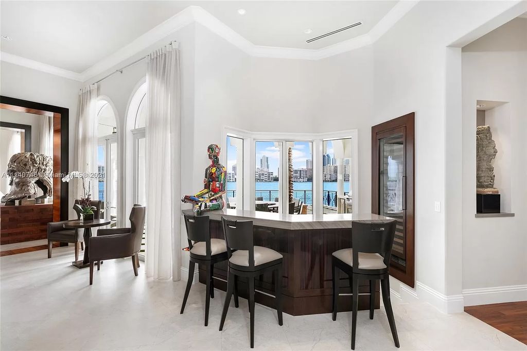 The Miami Beach Home is a unique tri-level estates sits along 251 feet of wide bay views and has 2 deeded docks now available for sale. This house located at 042 Island Estates Dr, North Miami Beach, Florida