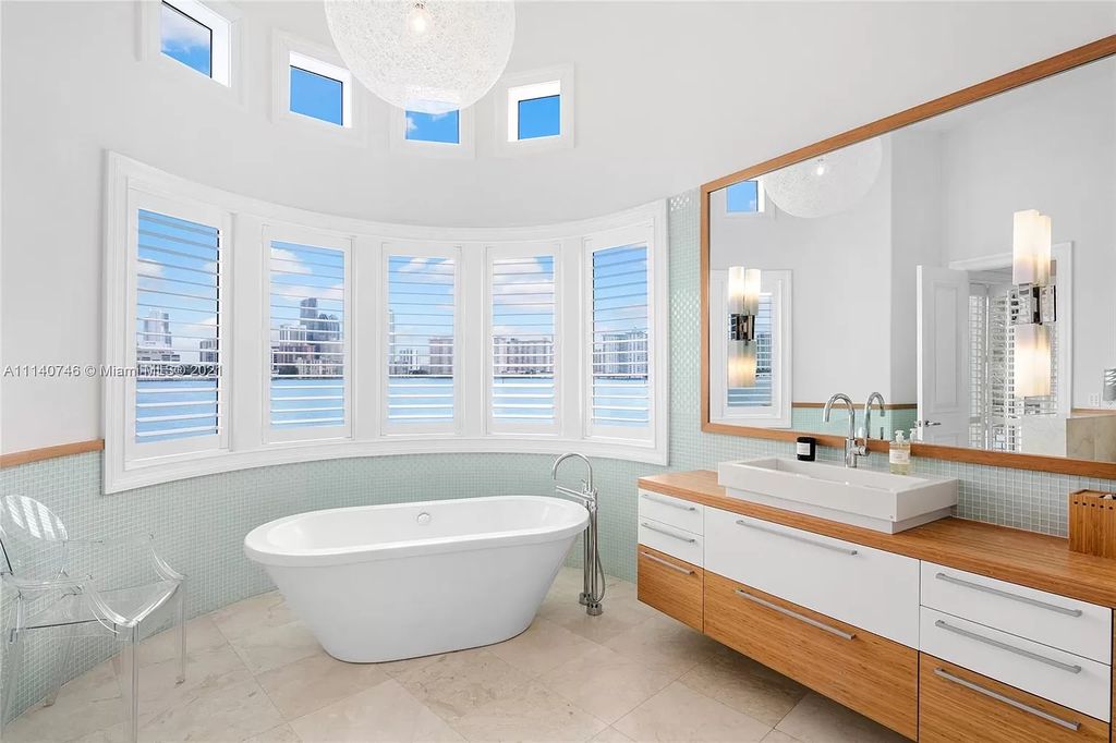 The Miami Beach Home is a unique tri-level estates sits along 251 feet of wide bay views and has 2 deeded docks now available for sale. This house located at 042 Island Estates Dr, North Miami Beach, Florida