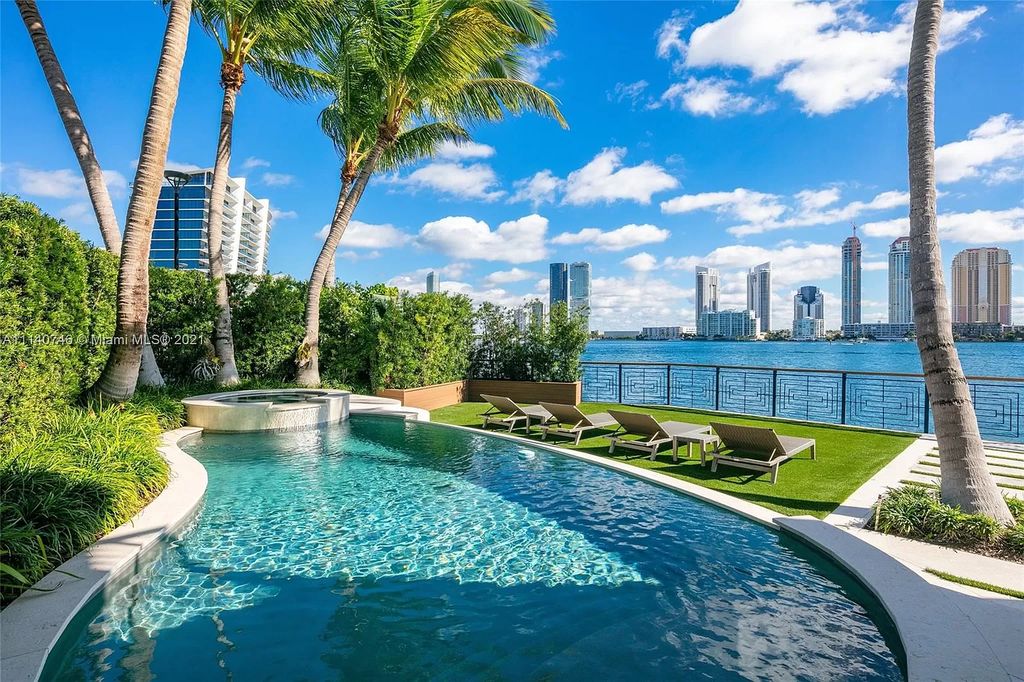The Miami Beach Home is a unique tri-level estates sits along 251 feet of wide bay views and has 2 deeded docks now available for sale. This house located at 042 Island Estates Dr, North Miami Beach, Florida
