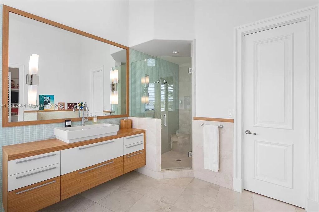 The Miami Beach Home is a unique tri-level estates sits along 251 feet of wide bay views and has 2 deeded docks now available for sale. This house located at 042 Island Estates Dr, North Miami Beach, Florida