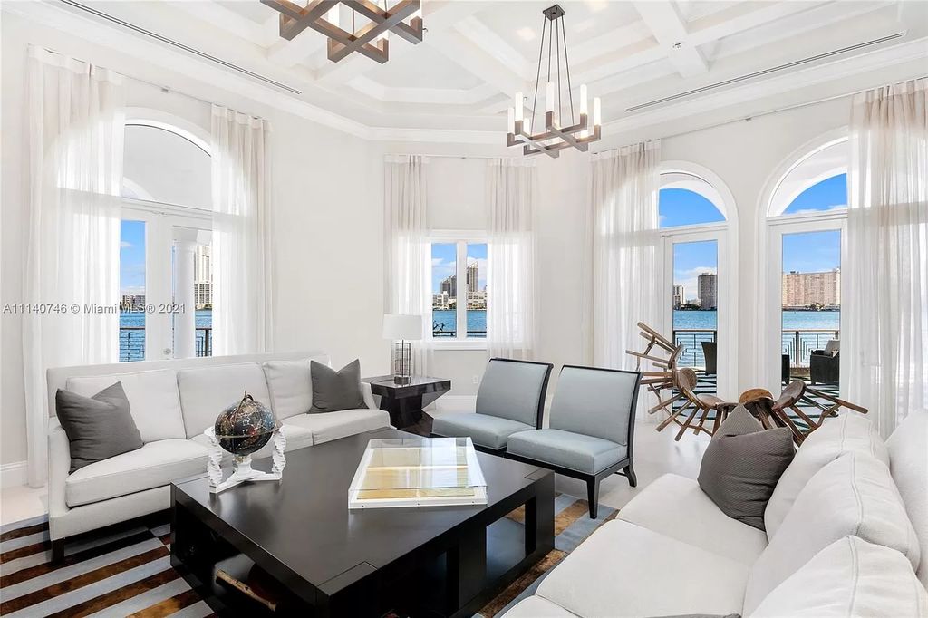 The Miami Beach Home is a unique tri-level estates sits along 251 feet of wide bay views and has 2 deeded docks now available for sale. This house located at 042 Island Estates Dr, North Miami Beach, Florida