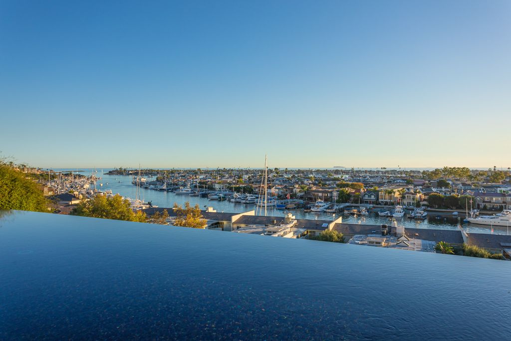 The Home in Corona Del Mar is an unparalleled design and unrivaled construction quality with explosive front-row panoramic views now available for sale. This house located at 1301 Dolphin Ter, Corona Del Mar, California