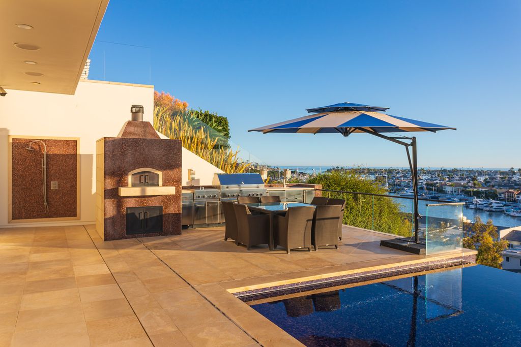 The Home in Corona Del Mar is an unparalleled design and unrivaled construction quality with explosive front-row panoramic views now available for sale. This house located at 1301 Dolphin Ter, Corona Del Mar, California