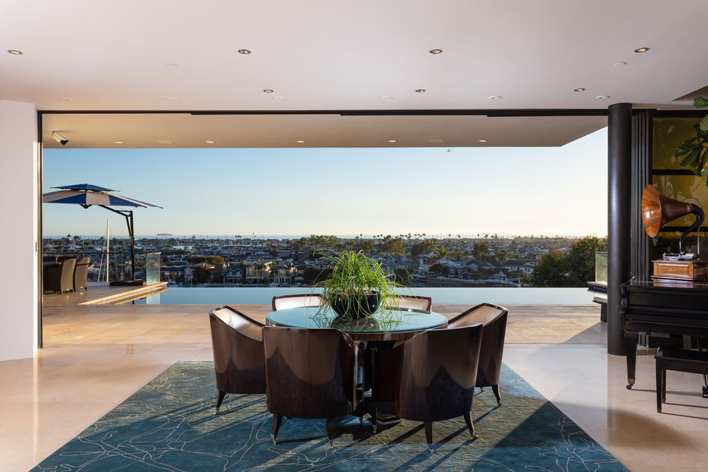 The Home in Corona Del Mar is an unparalleled design and unrivaled construction quality with explosive front-row panoramic views now available for sale. This house located at 1301 Dolphin Ter, Corona Del Mar, California