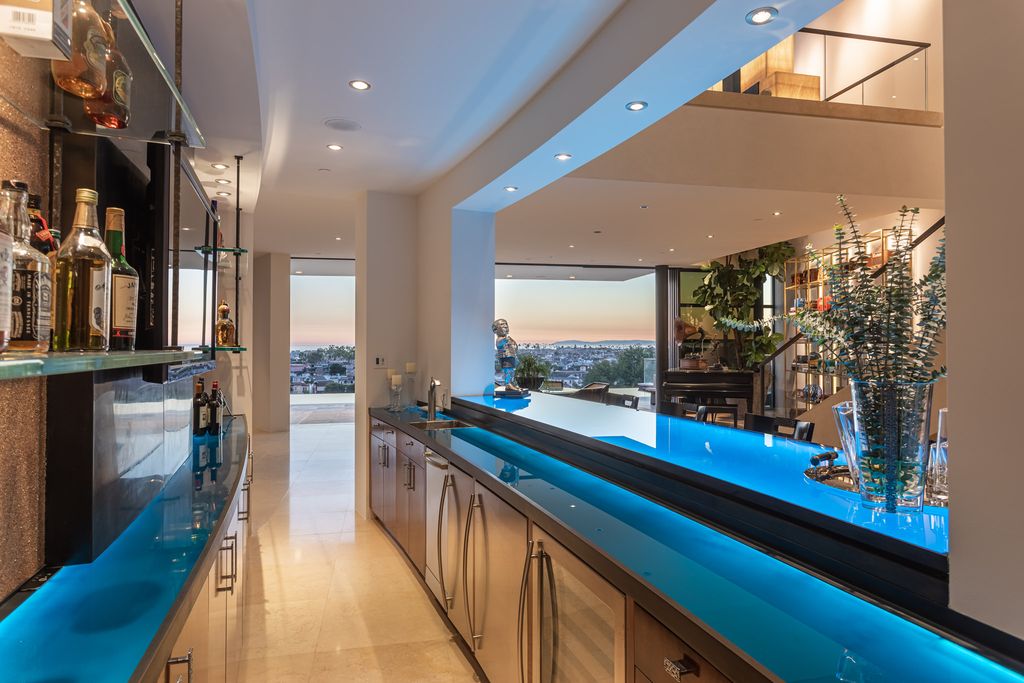 The Home in Corona Del Mar is an unparalleled design and unrivaled construction quality with explosive front-row panoramic views now available for sale. This house located at 1301 Dolphin Ter, Corona Del Mar, California