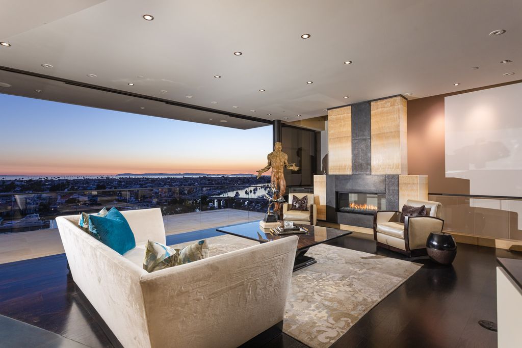 The Home in Corona Del Mar is an unparalleled design and unrivaled construction quality with explosive front-row panoramic views now available for sale. This house located at 1301 Dolphin Ter, Corona Del Mar, California