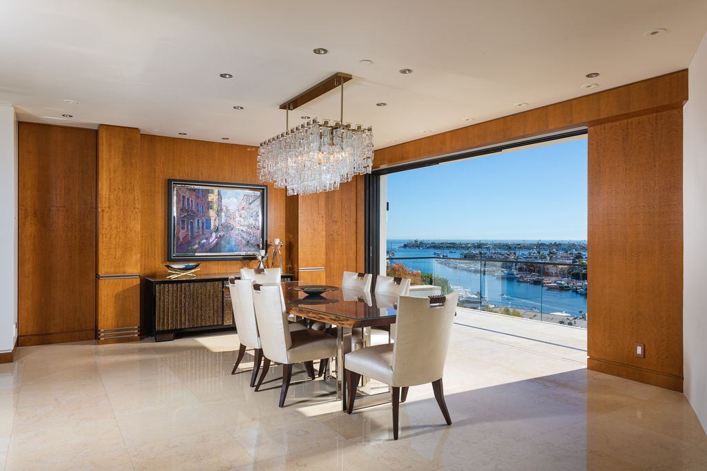 The Home in Corona Del Mar is an unparalleled design and unrivaled construction quality with explosive front-row panoramic views now available for sale. This house located at 1301 Dolphin Ter, Corona Del Mar, California