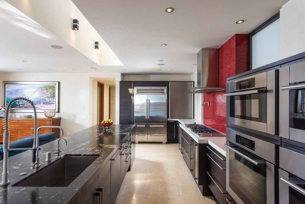 The Home in Corona Del Mar is an unparalleled design and unrivaled construction quality with explosive front-row panoramic views now available for sale. This house located at 1301 Dolphin Ter, Corona Del Mar, California
