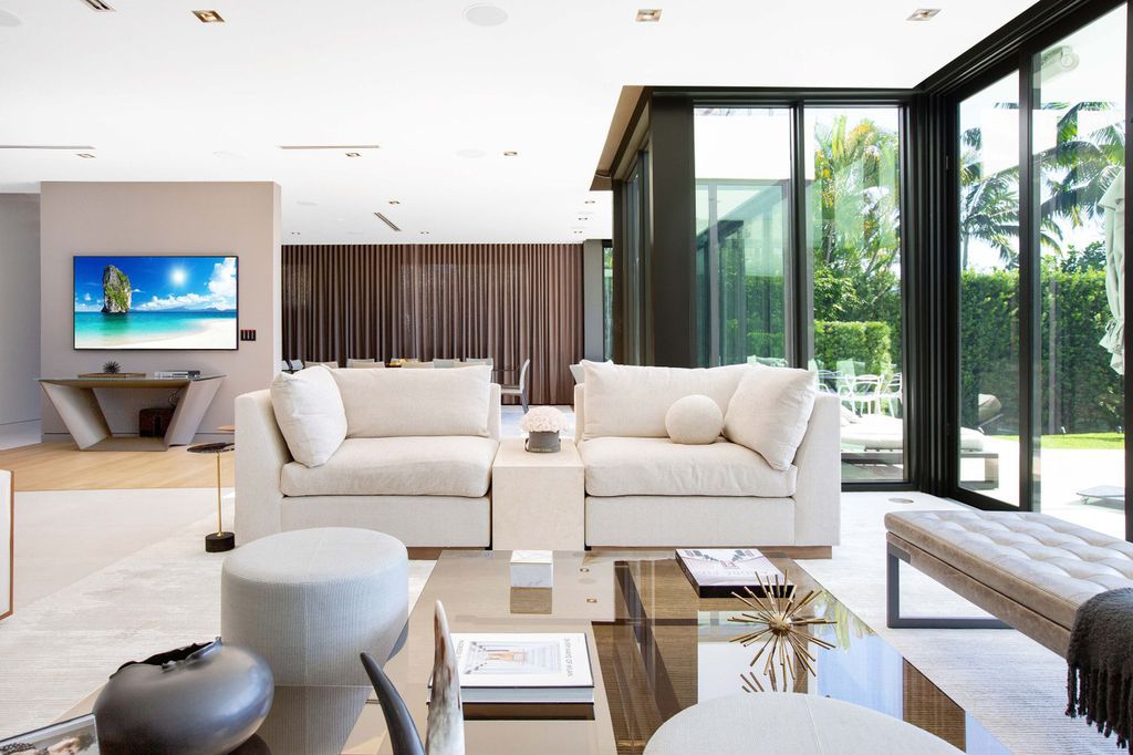 The Miami Beach Home is a new construction home located on a quiet street with direct access to the prestigious La Gorce Country Club now available for sale. This house located at 450 W 62nd St, Miami Beach, Florida