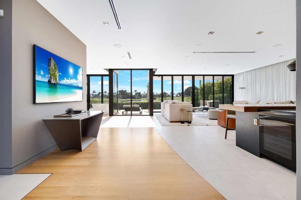 The Miami Beach Home is a new construction home located on a quiet street with direct access to the prestigious La Gorce Country Club now available for sale. This house located at 450 W 62nd St, Miami Beach, Florida