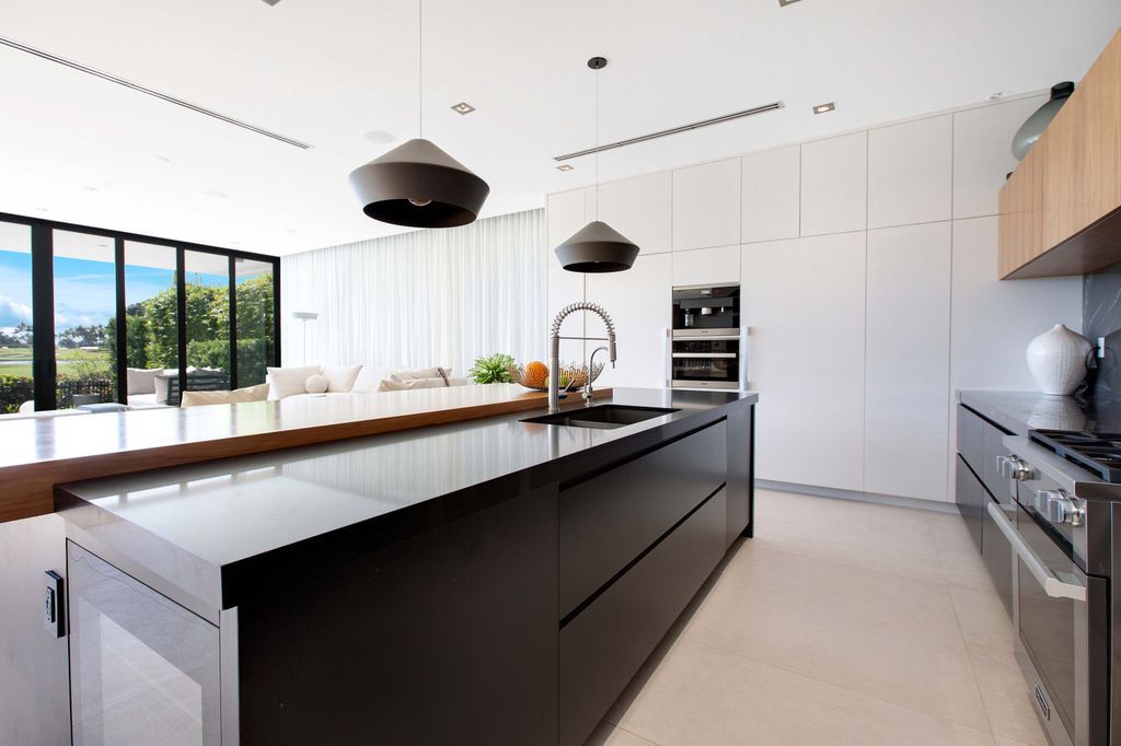 The Miami Beach Home is a new construction home located on a quiet street with direct access to the prestigious La Gorce Country Club now available for sale. This house located at 450 W 62nd St, Miami Beach, Florida
