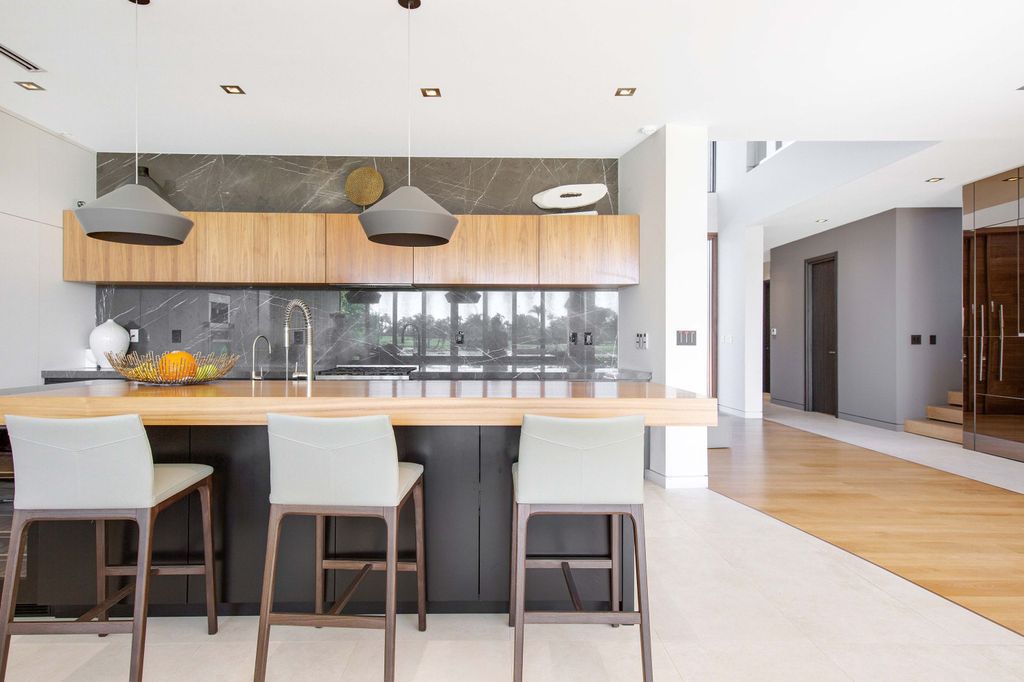 The Miami Beach Home is a new construction home located on a quiet street with direct access to the prestigious La Gorce Country Club now available for sale. This house located at 450 W 62nd St, Miami Beach, Florida