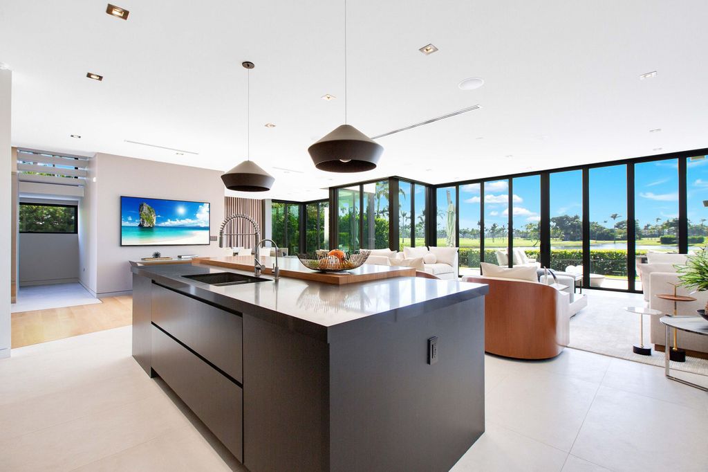 The Miami Beach Home is a new construction home located on a quiet street with direct access to the prestigious La Gorce Country Club now available for sale. This house located at 450 W 62nd St, Miami Beach, Florida