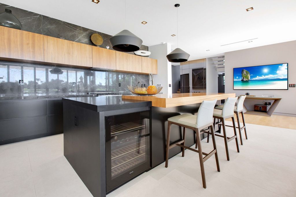 The Miami Beach Home is a new construction home located on a quiet street with direct access to the prestigious La Gorce Country Club now available for sale. This house located at 450 W 62nd St, Miami Beach, Florida
