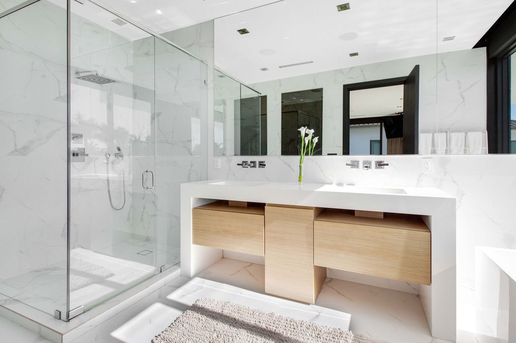 The Miami Beach Home is a new construction home located on a quiet street with direct access to the prestigious La Gorce Country Club now available for sale. This house located at 450 W 62nd St, Miami Beach, Florida