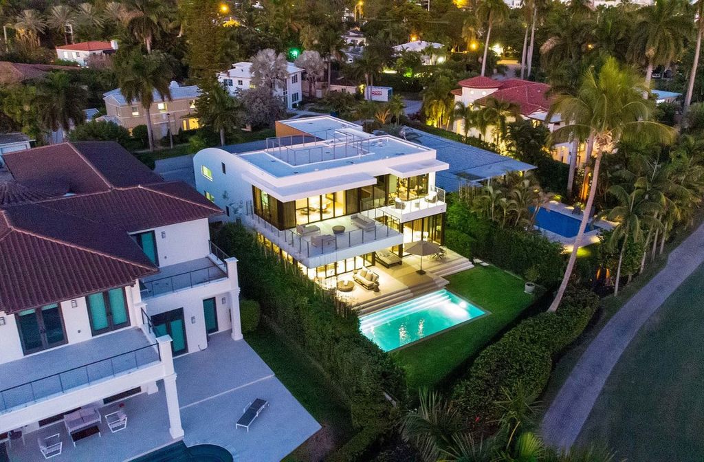 The Miami Beach Home is a new construction home located on a quiet street with direct access to the prestigious La Gorce Country Club now available for sale. This house located at 450 W 62nd St, Miami Beach, Florida