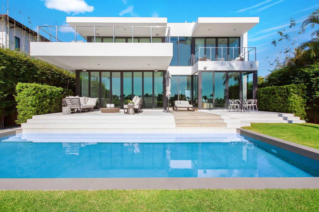 The Miami Beach Home is a new construction home located on a quiet street with direct access to the prestigious La Gorce Country Club now available for sale. This house located at 450 W 62nd St, Miami Beach, Florida