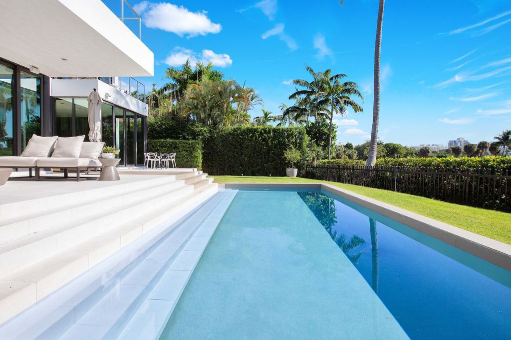 The Miami Beach Home is a new construction home located on a quiet street with direct access to the prestigious La Gorce Country Club now available for sale. This house located at 450 W 62nd St, Miami Beach, Florida
