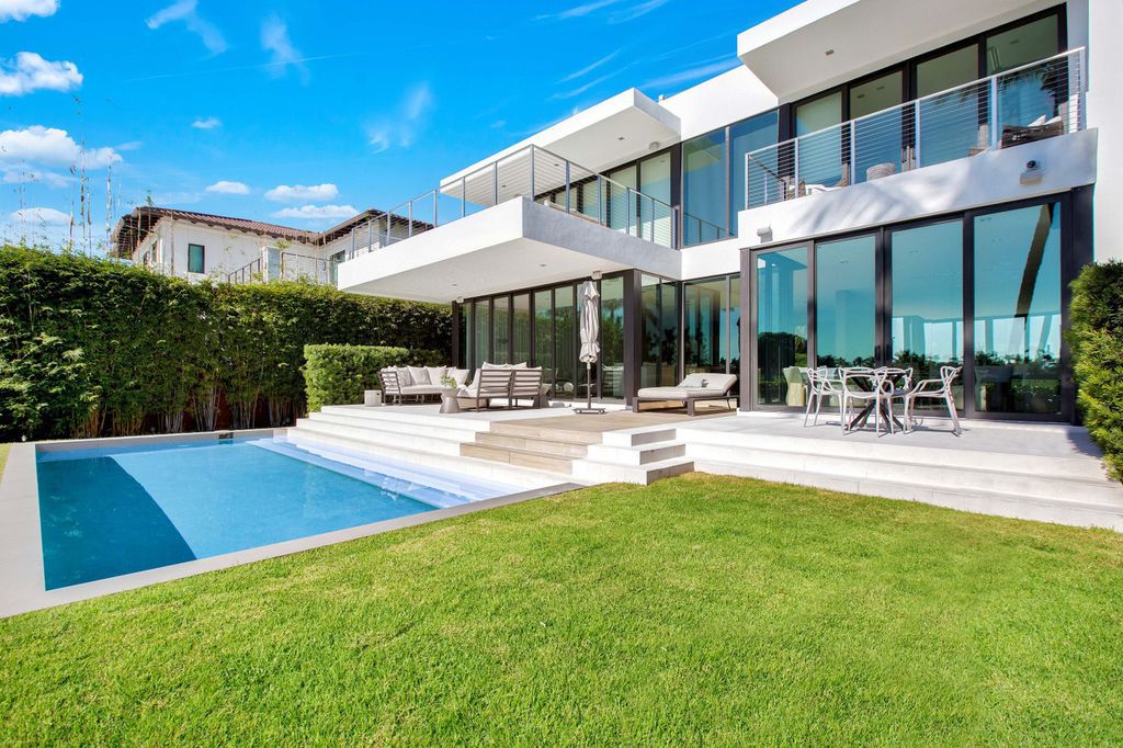 The Miami Beach Home is a new construction home located on a quiet street with direct access to the prestigious La Gorce Country Club now available for sale. This house located at 450 W 62nd St, Miami Beach, Florida