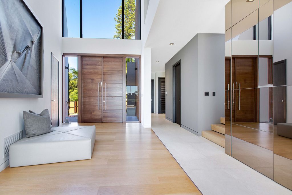 The Miami Beach Home is a new construction home located on a quiet street with direct access to the prestigious La Gorce Country Club now available for sale. This house located at 450 W 62nd St, Miami Beach, Florida
