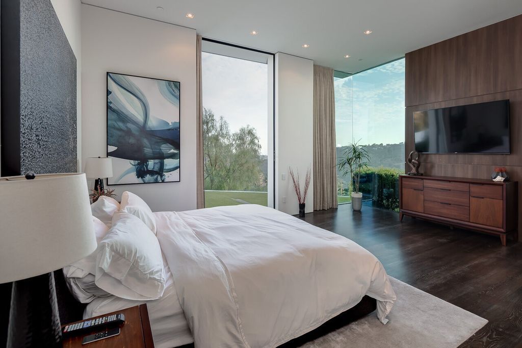 The Mansion in Beverly Hills is a one of a kind contemporary compound sits on a promontory with 270 degree views now available for sale. This home located at 3000 Benedict Canyon Dr, Beverly Hills, California