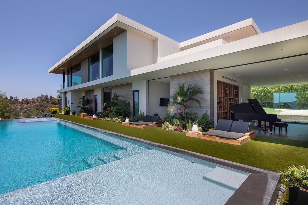 The Mansion in Beverly Hills is a one of a kind contemporary compound sits on a promontory with 270 degree views now available for sale. This home located at 3000 Benedict Canyon Dr, Beverly Hills, California