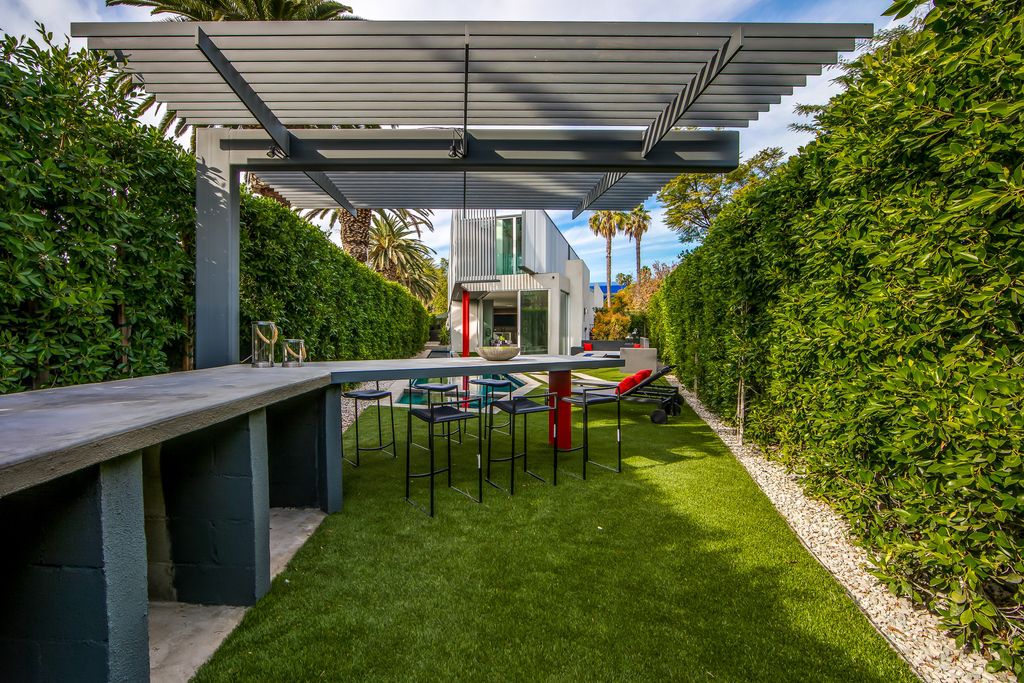 The Home in West Hollywood is a modern oasis masterfully balances cool contemporary design with lush greenery now available for sale. This house located at 417 Norwich Dr, West Hollywood, California