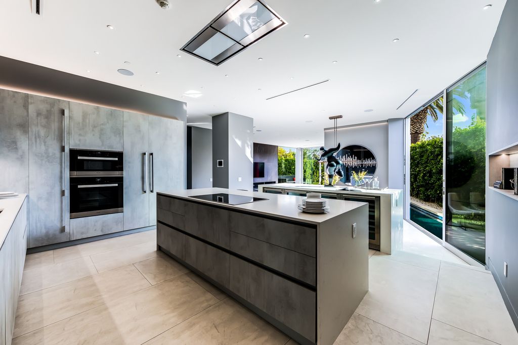 The Home in West Hollywood is a modern oasis masterfully balances cool contemporary design with lush greenery now available for sale. This house located at 417 Norwich Dr, West Hollywood, California