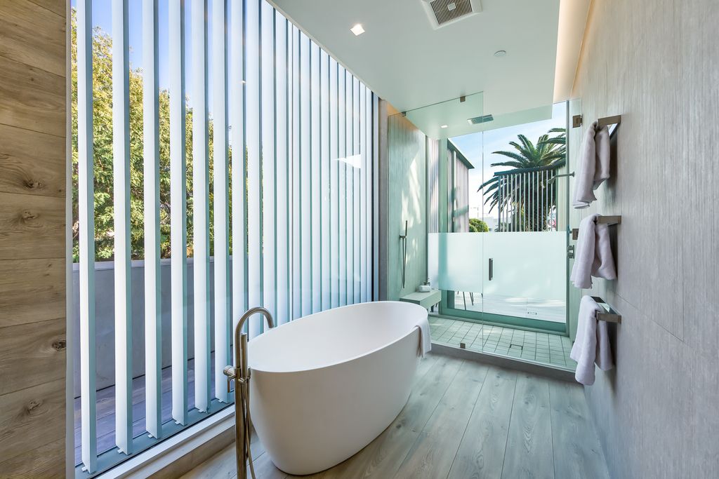 The Home in West Hollywood is a modern oasis masterfully balances cool contemporary design with lush greenery now available for sale. This house located at 417 Norwich Dr, West Hollywood, California
