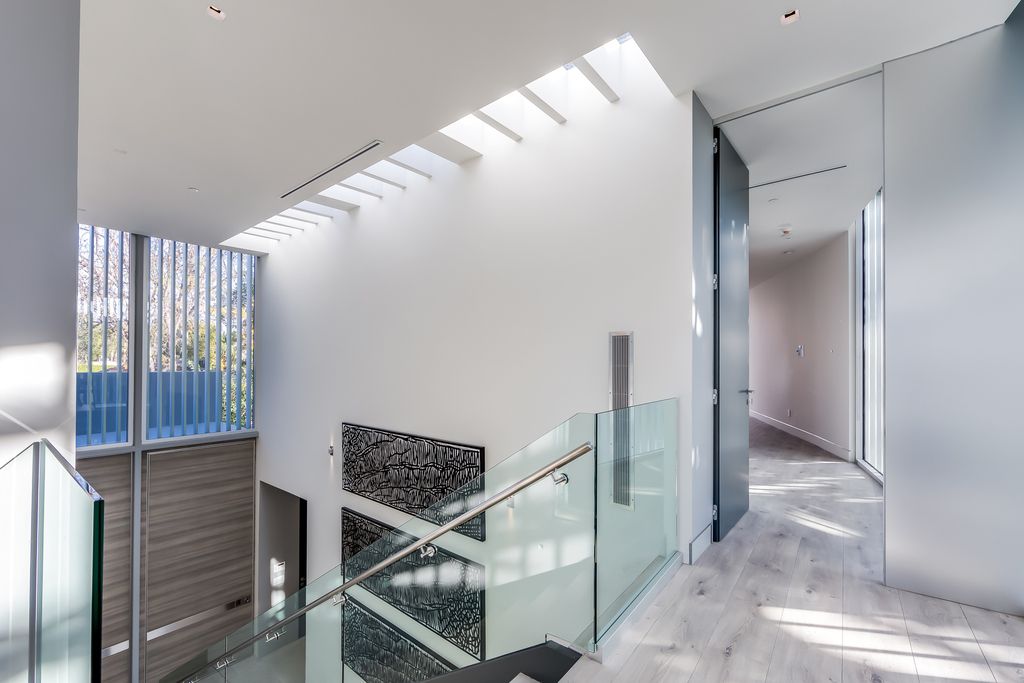 The Home in West Hollywood is a modern oasis masterfully balances cool contemporary design with lush greenery now available for sale. This house located at 417 Norwich Dr, West Hollywood, California