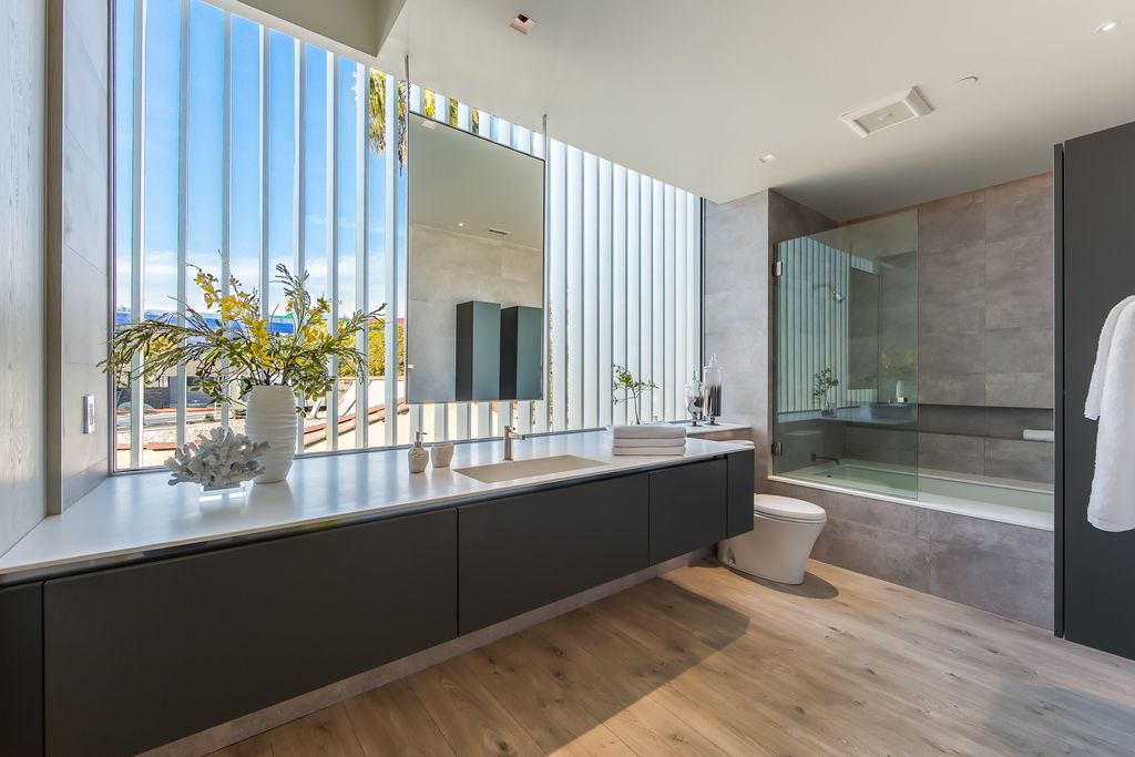 The Home in West Hollywood is a modern oasis masterfully balances cool contemporary design with lush greenery now available for sale. This house located at 417 Norwich Dr, West Hollywood, California