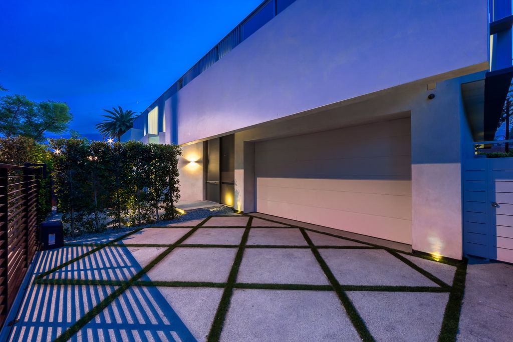 The Home in West Hollywood is a modern oasis masterfully balances cool contemporary design with lush greenery now available for sale. This house located at 417 Norwich Dr, West Hollywood, California
