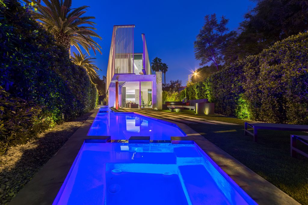 The Home in West Hollywood is a modern oasis masterfully balances cool contemporary design with lush greenery now available for sale. This house located at 417 Norwich Dr, West Hollywood, California