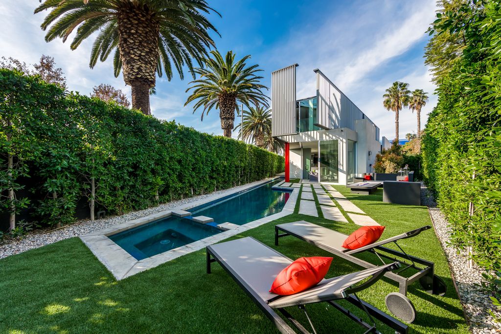 The Home in West Hollywood is a modern oasis masterfully balances cool contemporary design with lush greenery now available for sale. This house located at 417 Norwich Dr, West Hollywood, California